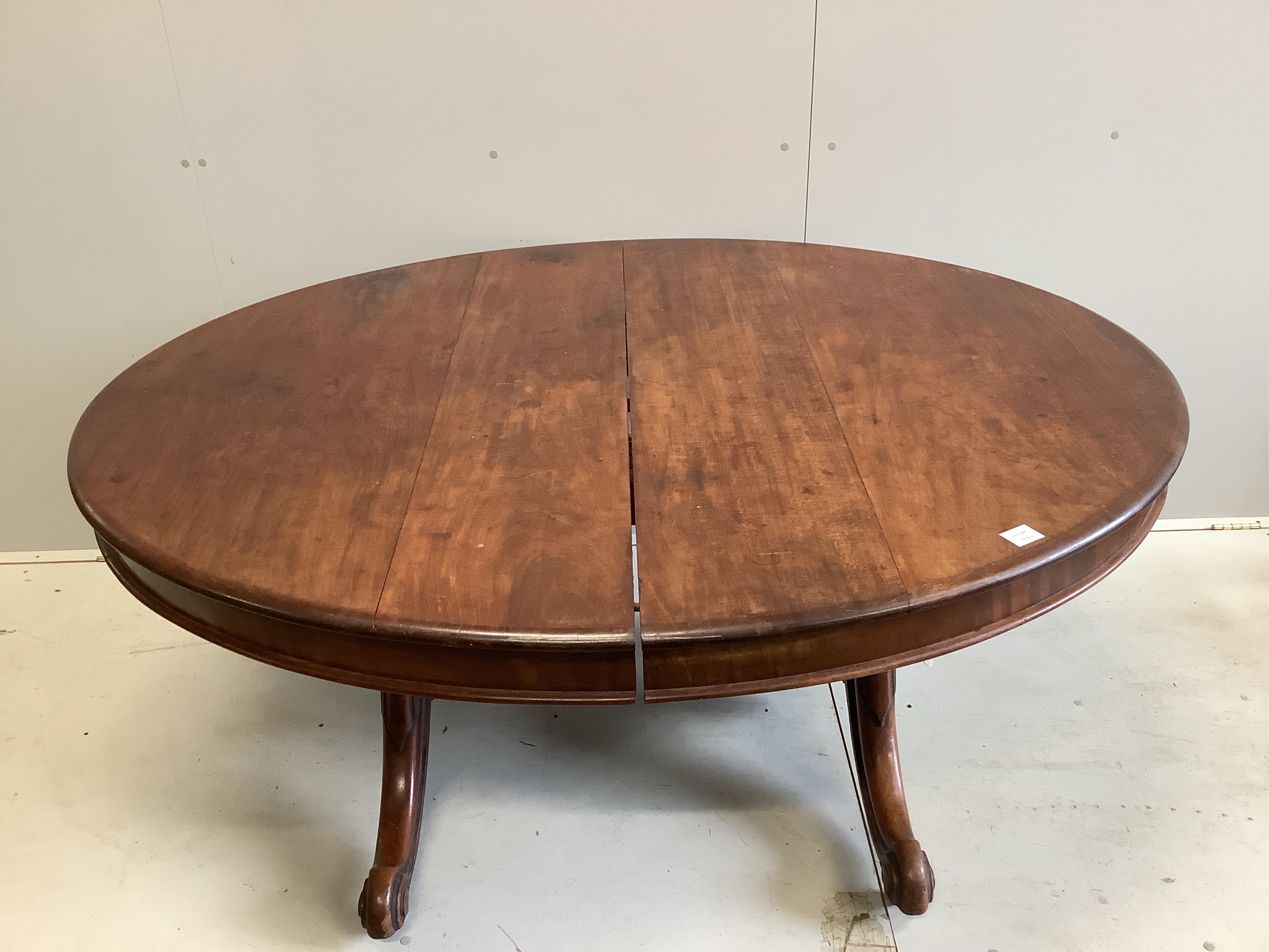 A Victorian mahogany twin pillar extending dining table, 246cm extended, two spare leaves, depth 134cm, height 71cm. Condition - fair